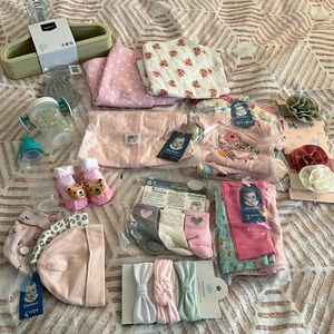 Make an offer! Various bag of baby girl clothes, bows, hangers, etc Worth $70